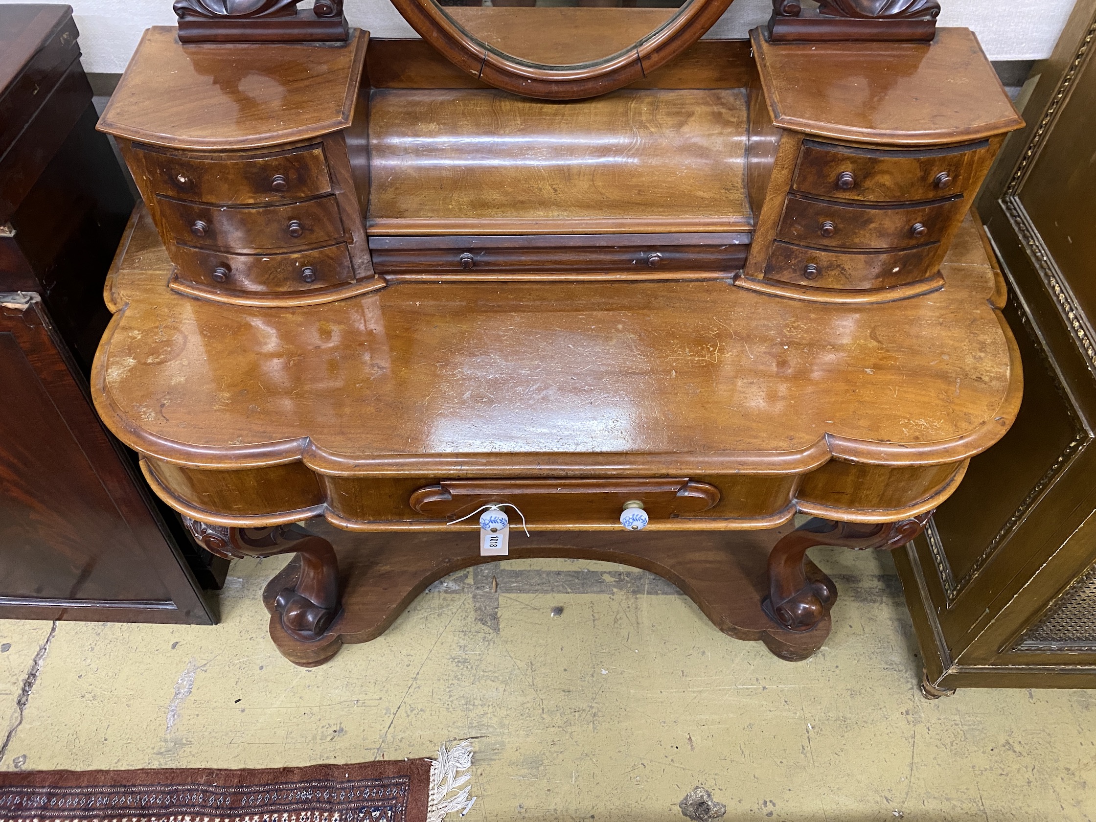 A Victorian mahogany Duchesse dressing table, width 126cm, depth 50cm, height 159cm